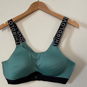 ThirdLove Kinetic Wireless Sports Bra in a teal or blue mist color with black